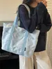 Bolso tote simple de gran capacidad, nuevo bolso tote casual de lona de color liso, estilo moderno, bolso de hombro para el trabajo, principios de otoño 2026