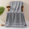 Algodón al por mayor transfronterizo de 32 hilos, engrosado para el hogar, absorbente, ampliado, toalla de baño, comercio exterior, juego de toallas lisas para hotel, toalla de baño