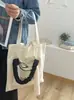 Bolsa de lona estilo minimalista coreano color blanco roto con estampado, gran capacidad, adecuada para estudiantes, para ir al trabajo y uso artístico, bolsa de tela de un solo hombro