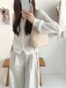 Novo estilo coreano retrô, bolsa de ombro tecida em couro PU macio, de nicho, para mulheres, moderna e sofisticada, adequada para o trajeto diário, pode ser carregada na mão ou usada sob o braço