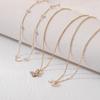 Collar de mariposa con perlas multicapa y diamantes para mujer, estilo moderno y popular en Internet, cadena de clavícula de nicho simple, nuevo estilo, elegante.