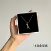 [56] logotipo de comercio exterior sin marca acero de titanio joyería Europa y Estados Unidos variedad de hip-hop apilado collar de clavícula de acero de titanio