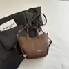 Bolso Cubo Estilo Nuevo Simple Retro Bolso Casual de Moda 2026 Otoño Nuevo Estilo Bolso de Hombro Cruzado Texturizado para Mujer