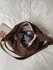 Bolso de mano de alta gama, exquisito para mujer, nuevo modelo 2026, bandolera de correa ancha, bolso casual y moderno de tela simple tipo albóndiga