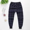 Calça térmica infantil 2026 outono e inverno, calça de dormir quentinha para meninos e meninas, material 100% algodão, calça de casa infantil estampada da moda, em estoque