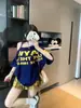 Camiseta de Tirantes con Estampado de Letras y Hombros Descubiertos de Manga Corta para Mujer Verano Diseño Americano Holgado Sexy Top Versátil de Media Manga