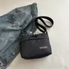 Bolso bandolera deportivo sencillo para hombres y mujeres, mochila pequeña nueva de cuadros, bolso de hombro casual para el trabajo para parejas, bolso de moda para hombre