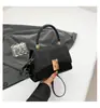 Bolsa cuadrada pequeña popular 2026, bolso de mano versátil, bolso cruzado casual simple, bolso de hombro versátil y moderno para mujer