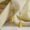 Novos Brincos Longos de Abóbora Dourada Estilo Chinês, Brincos de Disco Espiraladores de Mosquito, Luxo Acessível, High-End, Elegantes e Atmosféricos Brincos de Franja