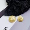 Europeo y Americano estilo Chanel redondo botón de metal dorado abrigo suéter cárdigan de punto botón cortavientos traje chaqueta hebilla