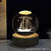 Luz Noturna de Bola de Cristal Gravada a Laser 3D Criativa Atacado Presente Ornamento de Bola de Vidro Luminosa para Quarto de Namorado e Namorada