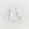 Camiseta base de estilo coreano para niña, nueva colección otoño 2026, elegante camiseta para bebé con cuello de volantes, camiseta lisa para niños