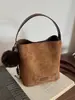 Bolsa popular para mujer transfronteriza de este año: Bolso cubeta vintage esmerilado de moda versátil para el otoño de 2026 con correa cruzada texturizada