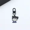 Detective Conan Dibujo Animado Periférico Llavero de Aleación Gris Original Niño Kudo Shinichi Colgante para Mochila Escolar