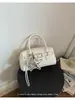 Bolso de mano de diseño de nicho nuevo para comercio transfronterizo, elegante bolso tipo bowling para el hombro y cruzado para el día a día con patrón tejido para mujer