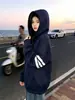 Sudadera con capucha a rayas de manga larga de diseño de nicho moderno estilo coreano para mujer, nuevo top versátil casual de otoño e invierno