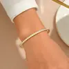 Pulseira de Moda Bicolor Ouro e Aço com Zircônias Cúbicas, Joia Versátil de Aço Inoxidável Simples e Única para Mulheres
