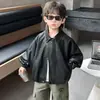 Chaqueta de Cuero para Niños Primavera y Otoño 2026 Nueva Chaqueta de Cuero de Motociclista con Solapas para Niños Top Holgado de Cuero PU para Bebé