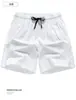 Bolsos Traseiros Cor Macaron Seda Gelada de Verão Shorts Casuais Esportivos para Casal Calças Masculinas Largas de Três Quartos Elástico