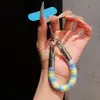 Correa de anillo superestilosa con bloques de color, duradera y resistente con un gancho de metal, un cordón para teléfono anti-pérdida para mujer para ir de compras