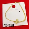 Cobre Chapado en Oro Nuevo Estilo Chino Antiguo Hueco Incrustado de Diamantes Mariposa Deslumbrante Collar Colgante de Mariposa de Oro Cepillado Joyería de Imitación de Oro para Mujer