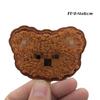 Venta al por mayor de fábrica nuevos stickers de tela con cabeza de oso de cuatro colores LOGO gabardina universal para hombre y mujer