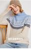 Suéter de cachemira jacquard de estilo étnico para mujer, suéter de punto de cuello alto medio, suelto y grueso, nuevo suéter de otoño e invierno con combinación de colores.