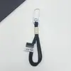 Venta al por mayor desde la fábrica de origen: Lanyards para llaves con mosquetón de bloques de color, colgantes para bolso de muñeca de peluche y accesorios. Se admiten pedidos de muestra