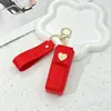 Bolso de moda para labiales transfronterizo con cierre en forma de corazón, caja de almacenamiento de perfume, colgante para llavero, estuche para labiales, funda protectora para labiales
