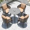 Mesa y silla de patio exterior Terraza Villa silla de ratán simple Ocio Jardín hierro Ratán tejido plástico madera placa de roca mesa de comedor con sombrilla