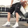 Pantalones de cinco puntos transpirables de verano para hombre, pantalones de moda de longitud media, pantalones casuales grandes, secado rápido, shorts de trabajo para estudiantes