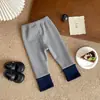 Em estoque QK262896 Calça infantil forrada com fleece 2026 outono estrela laço cor contrastante legging com punho