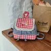 Mochila feminina estilo coreano com acabamento em renda doce, nova moda 2026, bolsa escolar xadrez color-blocking moderna, mochila pequena
