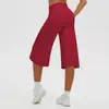 Pantalones capri de yoga de color liso, tela cepillada, estilo europeo y americano, transfronterizos, de cintura alta, control de abdomen, pierna ancha, casual para exteriores, atléticos y para fitness