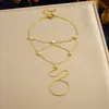Pulsera de Cadena Fina Dorada Brillante Venta Caliente Transfronteriza Europea y Americana Acero Inoxidable Chapado en Oro Sensación de Alta Gama Joyería para Mano de Mujer