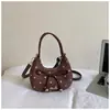 Exquisito bolso de lunares de nicho para mujer, nuevo bolso cruzado versátil de moda 2026, bolso de mano elegante de alta gama