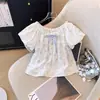 Camiseta Feminina Roupa de Verão 2026 Novo Estilo Coreano Manga Curta Menina Roupa de Verão Manga Bufante Doce Floral Top Roupa de Verão