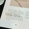 2025 Nuevo Estilo Popular Exquisito y de Gama Alta Diseño Anillo Liso de Doble Capa Pendientes de Diamante Flash Pendientes para Piercing en la Oreja Pendientes
