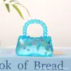 Bolso de mano de frutas Little Red Book transfronterizo, juguete de apretar con jarabe de malta para alivio del estrés y juguete de descompresión de rebote lento, venta al por mayor