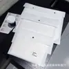 Saco interno de embalagem para roupas não tecido espessado logotipo personalizado saco de embalagem à prova de poeira para roupas saco de proteção ambiental