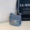 Bolsa Quadrada Pequena Minimalista Fashion e Única Modelo Novo Verão 2026 Porta-Moedas e Celular Bolsa Transversal de Brim Bordada de Alto Valor