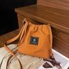 Textura de Moda Casual Nylon Cordón Mensajero Bolso Pequeño 2025 Casual Viajero Bolso de Hombro Moda Viaje Bolso Tipo Cubo
