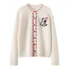 Nuevo suéter de cachemira para otoño e invierno con tejido jacquard de cachorros, abrigo cárdigan de cachemira grueso de alta gama para mujer con cuello redondo