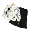 Conjunto de Suéter para Meninas Roupa de Tricô Duas Peças Infantil Novo Estilo de Comércio Exterior Conjunto de Cardigã com Laço para Meninas de 1 a 8 Anos