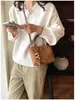 Bolso de hombro versátil, bolso de mano de alta gama de moda, bolso cubo de gamuza de nicho para el día a día, bolso cruzado de otoño e invierno