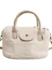 Bolso Peludo Portátil Transfronterizo para Mujer 2026 Nuevo Lindo de Peluche para Viajes Diarios Bolso Cubo Bajo el Brazo Bolso de Hombro Cruzado de Moda