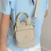 Tendencia Transfronteriza Bolsos de Mujer Verano 2026 Nuevo Bolso de Tela de Nylon Bolso de Mano para Mujer Ligero para Hombro Cruzado Bolso para Teléfono Móvil